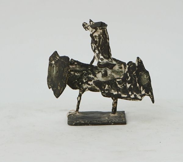 A bronze sculpture of a rooster