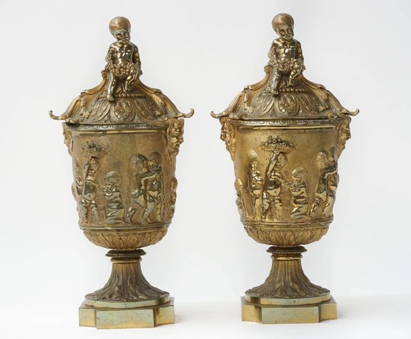 A pair of ormolu urns and covers