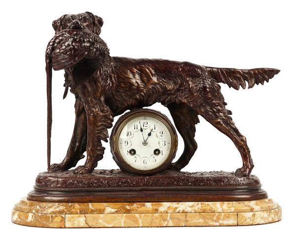 A patinated spelter mantel clock