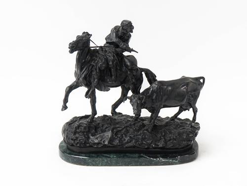 A BRONZE SCULPTURE 'THE CATTLE THIEF'