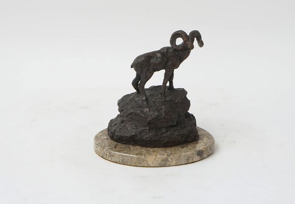 A bronze sculpture of a ram