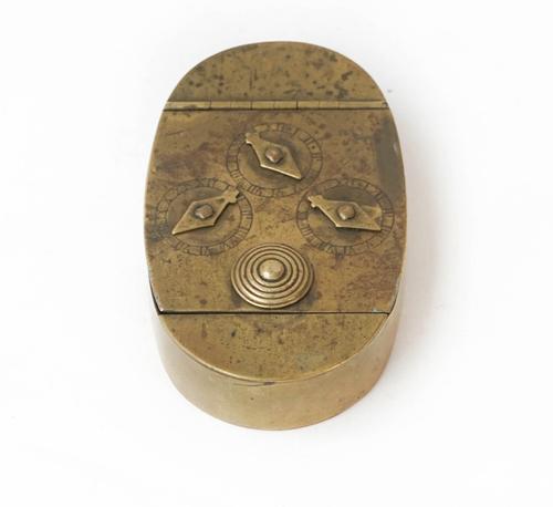 An oval brass three-dial combination lock snuff/tobacco box