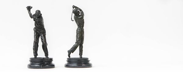 Two patinated bronze models of golfers