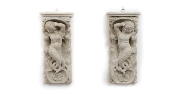 A pair of reconstituted marble wall brackets