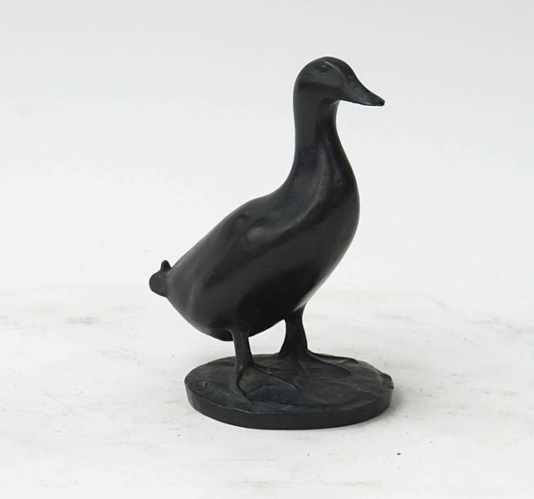 A bronze model of a duck