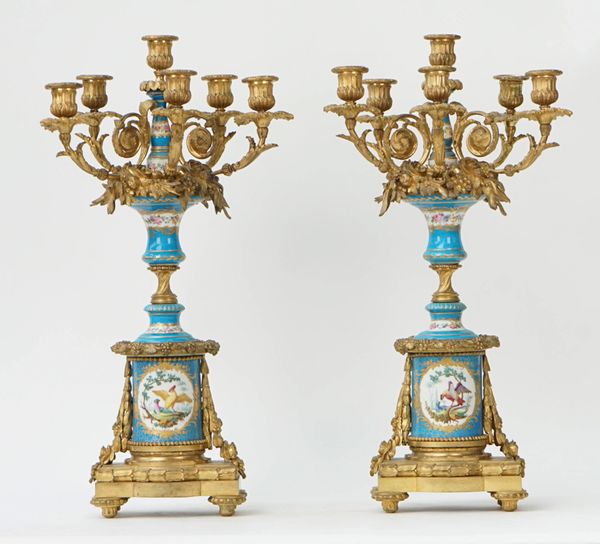 A pair of French gilt-bronze Sevres style six light candelabra