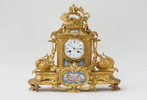 A French gilt-bronze and Sevres style mounted mantel clock