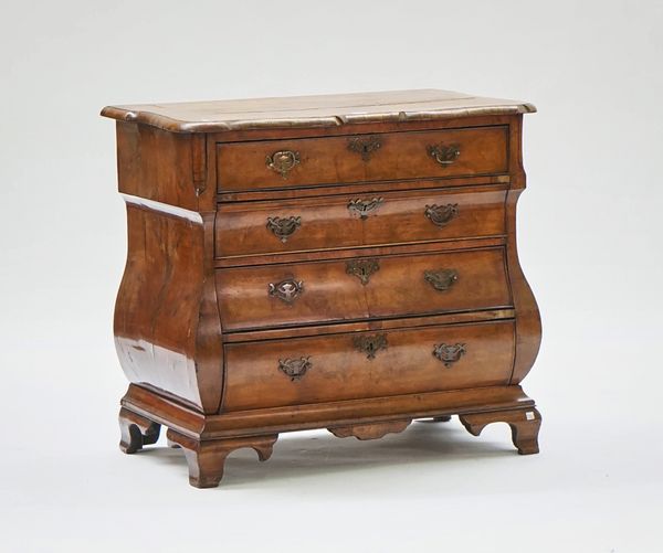 A Dutch inlaid figured walnut bombe four drawer commode