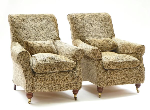 A pair of easy armchairs