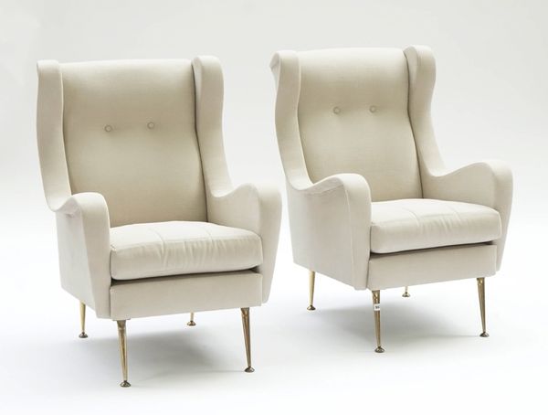 A pair of Retro Design wingback easy armchairs