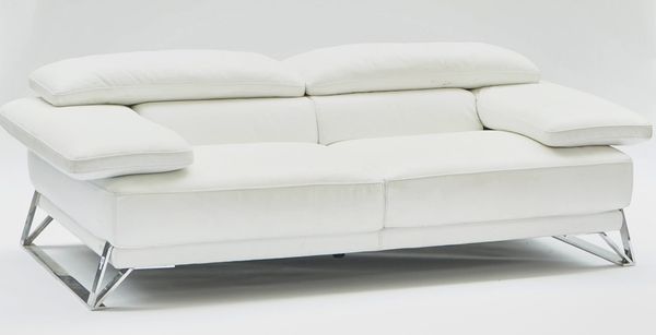 Roche-Bobois; A cream leather and chrome two seat sofa