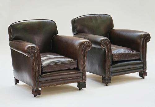 A pair of French style studded leather upholstered easy armchairs