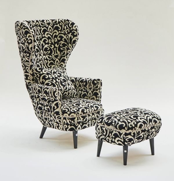 An exaggerated wingback easy armchair