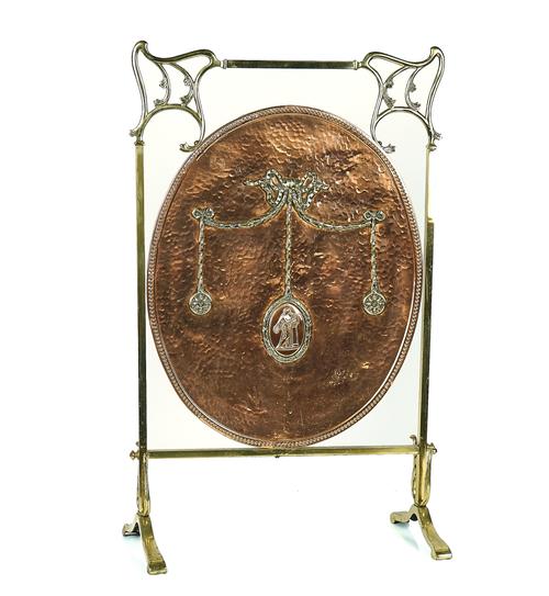 AN ARTS & CRAFTS BRASS AND COPPER FIRE GUARD