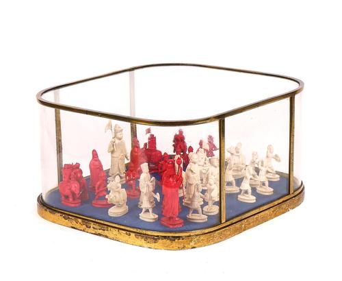 A CHINESE-EXPORT CARVED IVORY FIGURAL CHESS SET