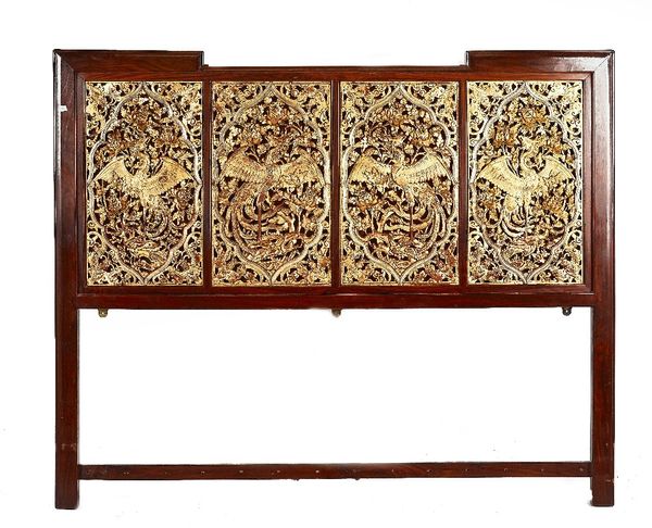 A SOUTH EAST ASIAN CARVED AND GILT DECORATED HARDWOOD FRAMED OPIUM BED PANEL (3)