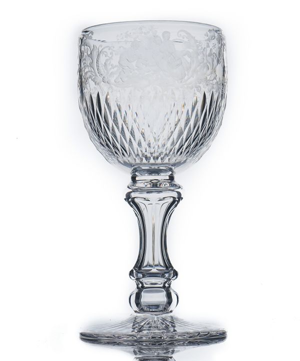 A LARGE ENGRAVED AND CUT GLASS GOBLET