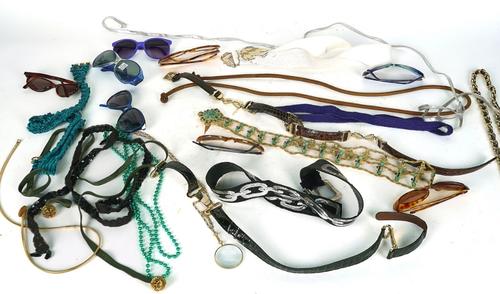 EIGHTEEN PAIRS OF SUNGLASSES, A QUANTITY OF BELTS AND BEADED NECKLACES AND A PAIR OF TURKISH SLIPPERS