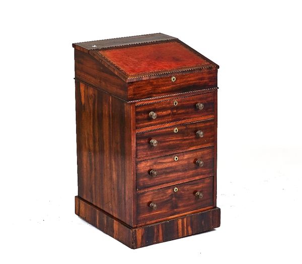 A 19TH-CENTURY ANGLO-INDIAN ROSEWOOD SWIVEL TOP DAVENPORT