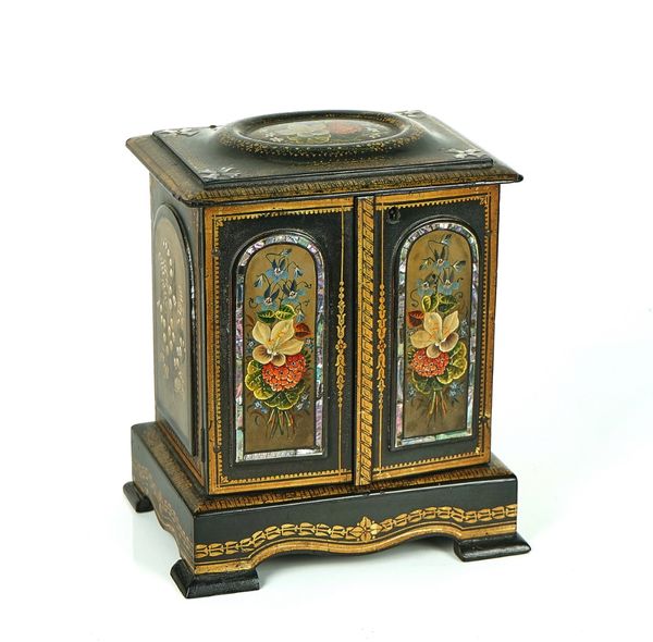 A VICTORIAN GILT AND POLYCHROME DECORATED PAPIER-MÂCHÉ JEWELLERY TABLE CABINET