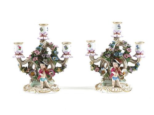 A PAIR OF MEISSEN PORCELAIN THREE-LIGHT FIGURAL CANDLESTICKS