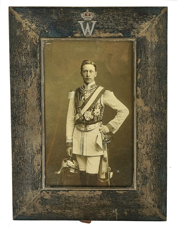 A GERMAN SILVER MOUNTED PHOTOGRAPH FRAME AND A STUDIO PHOTOGRAPH OF WILHELM II