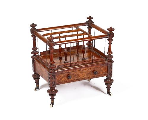 A VICTORIAN FIGURED WALNUT CANTERBURY