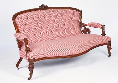 A VICTORIAN MAHOGANY CARVED SHOW FRAME SOFA