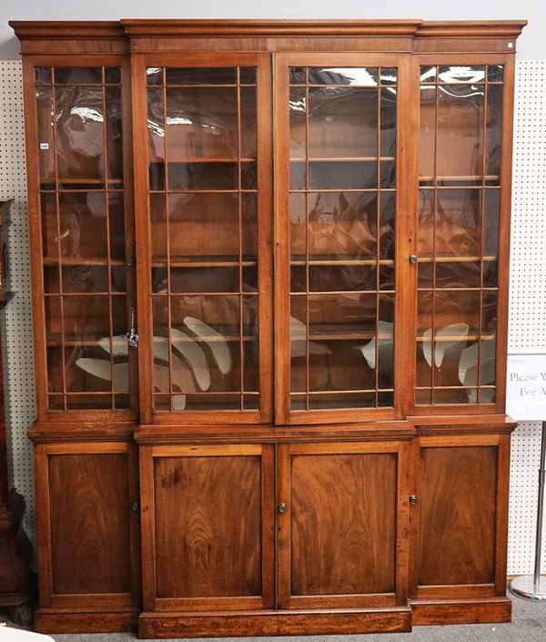 A GEORGE III MAHOGANY BREAKFRONT BOOKCASE CABINET