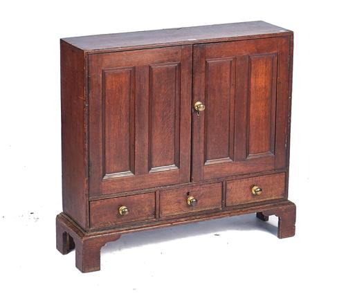 A MID-18TH CENTURY OAK LOW CUPBOARD