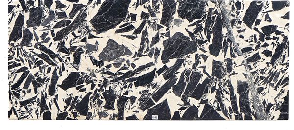 A RECTANGULAR SLAB OF NOIR GRAND ANTIQUE MARBLE