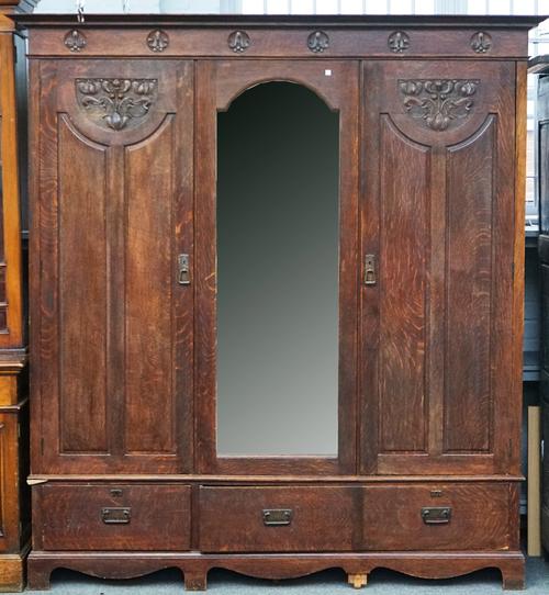 SHAPLAND & PETTER; A STAINED OAK TRIPLE WARDROBE