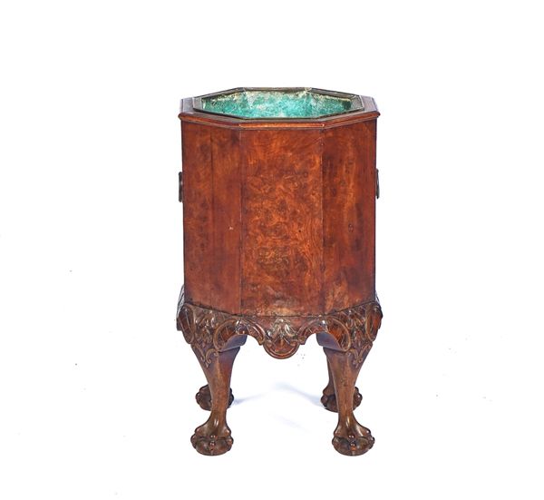 A GEORGE I STYLE FIGURED WALNUT OCTAGONAL JARDINIERE/WINE COOLER