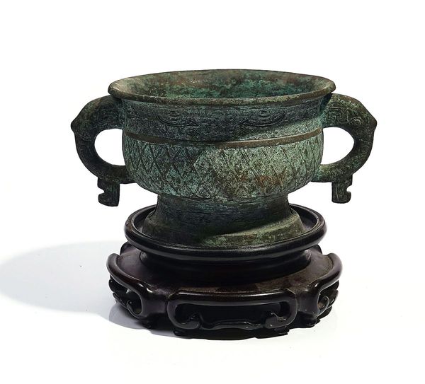 A CHINESE ARCHAISTIC BRONZE TWO-HANDLED CENSER (GUI)