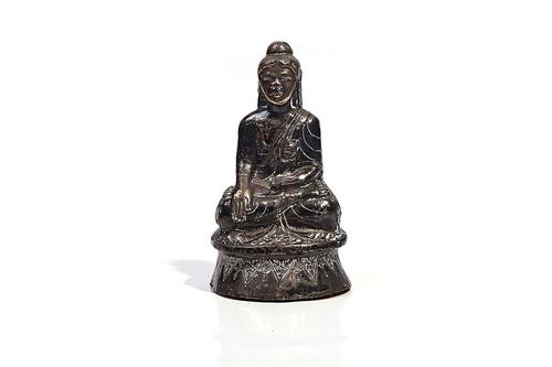 A SOUTH EAST ASIAN SILVER- COLOURED METAL BUDDHA