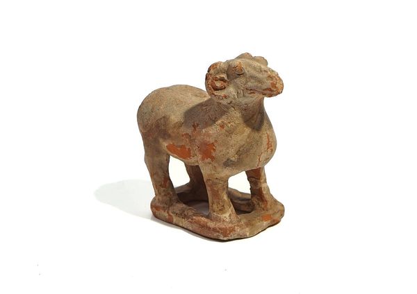 A CHINESE POTTERY FIGURE OF A RAM