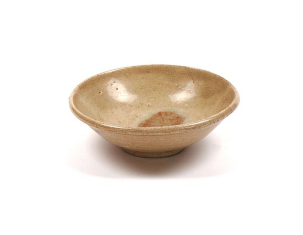 A SMALL CHINESE CREAM GLAZED SHALLOW BOWL