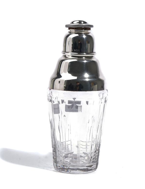 A SILVER AND FACETED GLASS COCKTAIL SHAKER