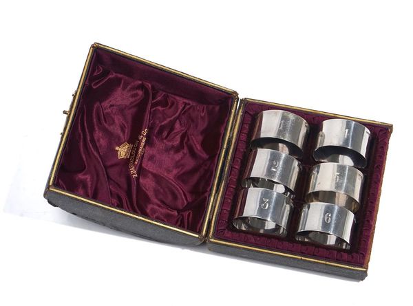 A VICTORIAN SET OF SIX SILVER NAPKIN RINGS, (6)