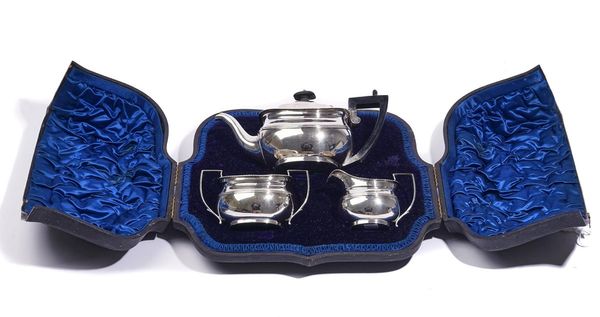 A SILVER THREE-PIECE TEA SET