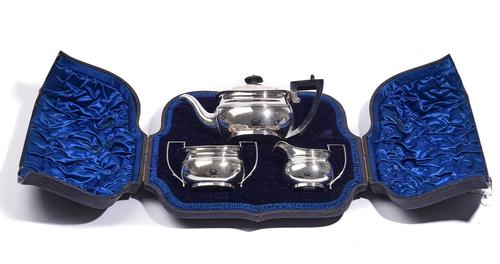 A SILVER THREE-PIECE TEA SET