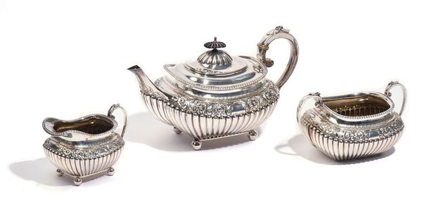 A SILVER THREE-PIECE TEA SET