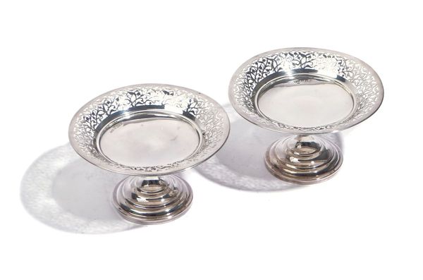 A PAIR OF SILVER PEDESTAL BONBON DISHES AND A SILVER MOUNTED TEAPOT STAND (3)