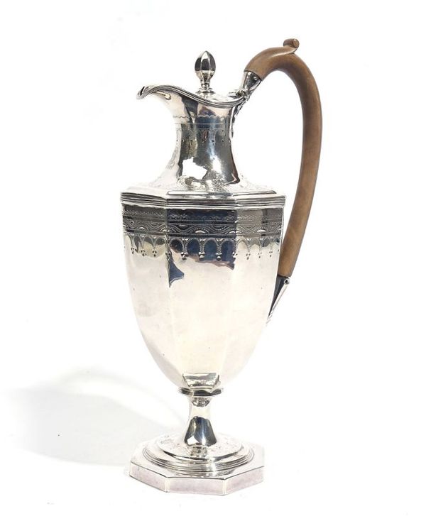 A GEORGE III SILVER HOT-WATER JUG