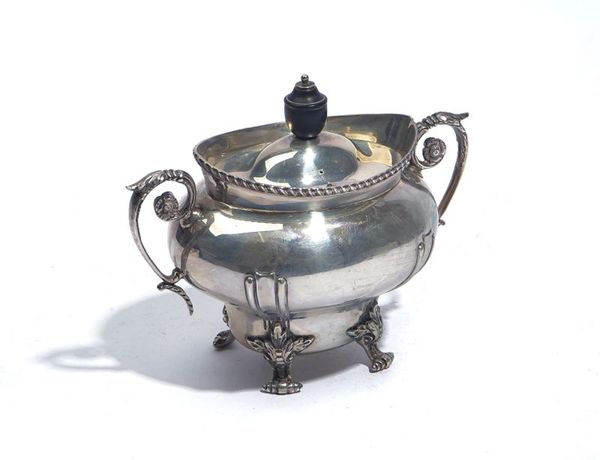 A SILVER TEA CADDY