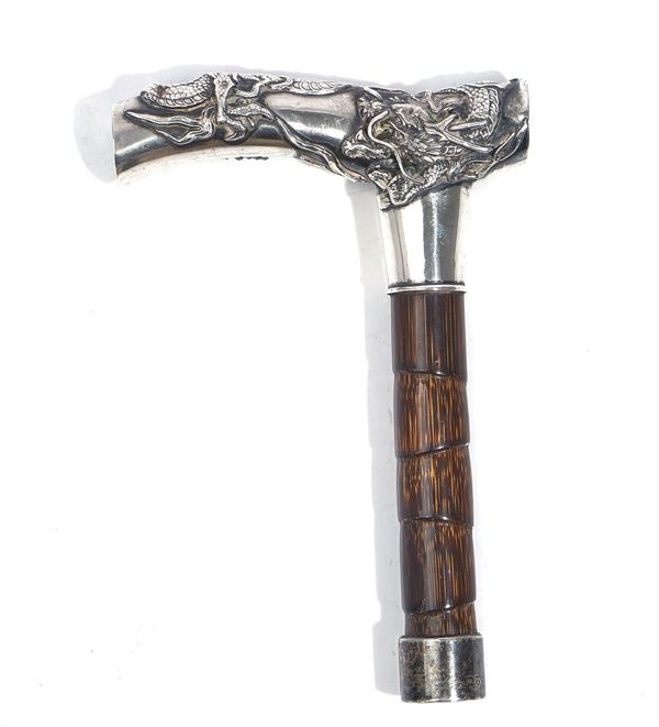 AN ASIAN CANE HANDLE