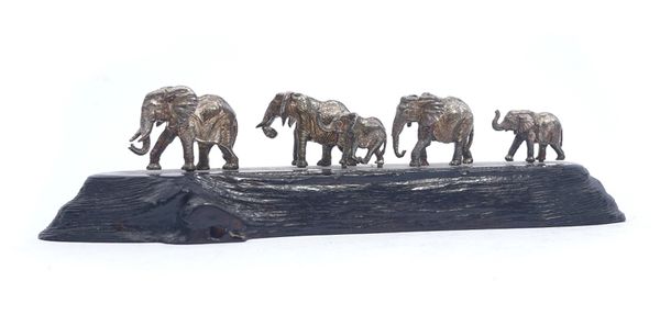 A PATRICK MAVROS SILVER MODEL OF A GROUP OF FIVE ELEPHANTS