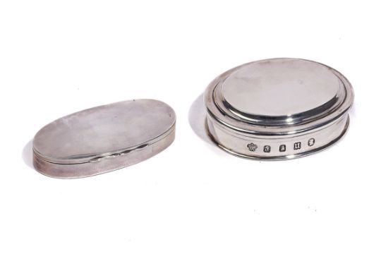 A SILVER OVAL BOX AND COVER AND A LADY'S SILVER MAKE-UP CASE (2)