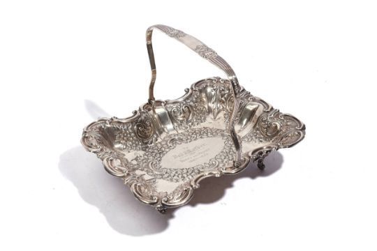 A SILVER SHAPED RECTANGULAR BASKET