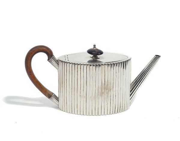 A GEORGE III SILVER TEAPOT